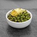 Artichokes with green peas and carrots