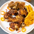 Fried goat tasso with plantain and pikliz...