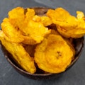 Fried plantains slices with pikliz