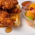 Chicken Tender & Waffle Belgian waffle cooked in cast iron with buttermilk 3 fried chicken tenders with a side of syrup.