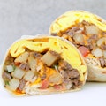 CALIFORNIA BREAKFAST BURRITO-Carne Asada, Eggs, French Fries, Cheese, Pico